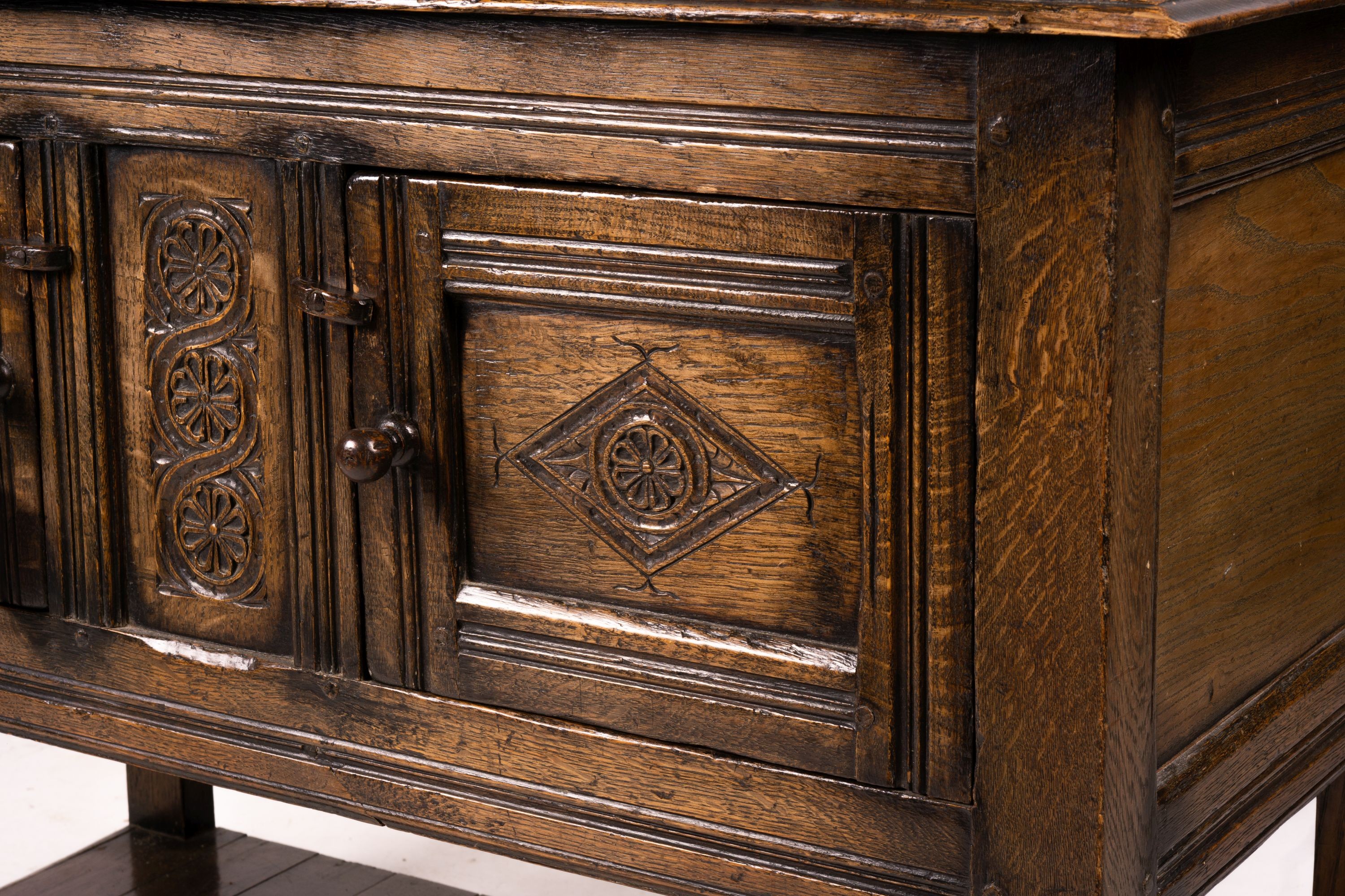 An 18th century style oak two door low cupboard, width 106cm, depth 50cm, height 78cm